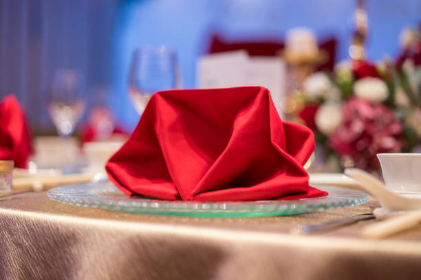 Checkered red tablecloth on wooden background. Copy space