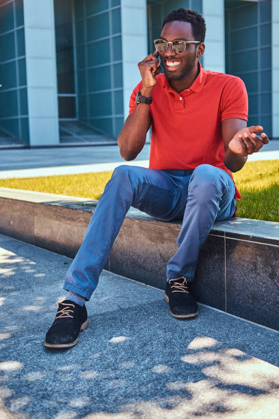 istock Handsome afro student is sitting near his work 1191902948