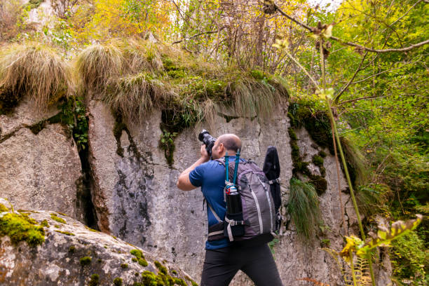 istock man tourist photographer on a mountain 1191903015