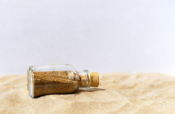 istock A small bottle of sea sand on the sand 1191904162