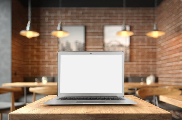 istock Blank open laptop on the coffee table with copy space 1191904237