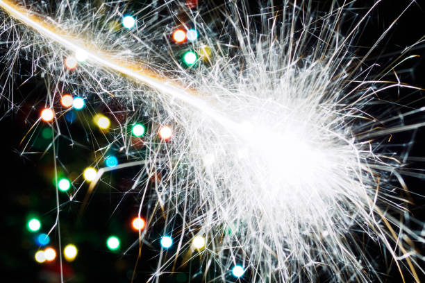 istock Bengal light flash on background christmas tree with garland lights. Abstract blurred backdrop 1191905720