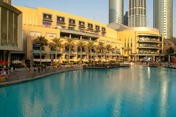 Dubai / UAE - November 5, 2019: World's largest shopping center. Dubai shopping mall exterior with tourists.