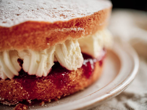 istock Close up of a Victoria Sponge Cake on a rustic plate. 1191910185