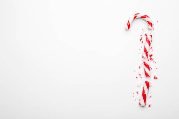 istock Broken Christmas candy canes on white background. Minimal composition with peppermint candies. Flat lay, top view with space for text 1191910915