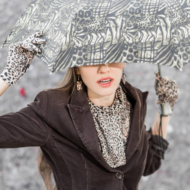 istock Young beautiful girl with umbrella 1191911507
