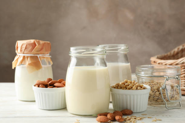 istock Glasses of different types milk on wooden background, space for text 1191913565