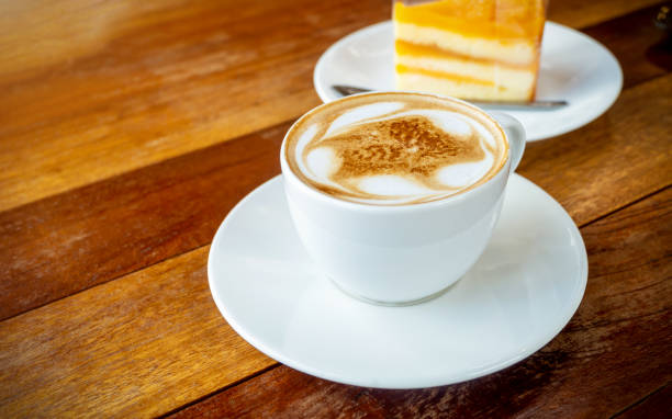 istock White coffee cup, Latte coffee on wooden table in coffee shop, with empty space for text. concept relax 1191915437