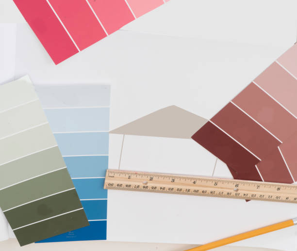 istock Items on an architects table are used to design a dream home. 1191922112