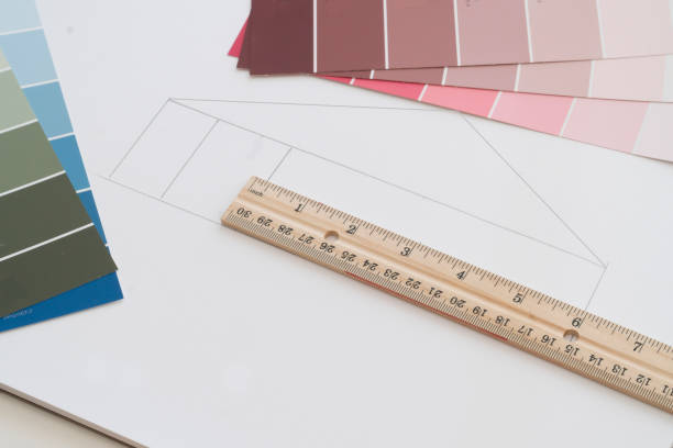 istock Items on an architects table are used to design a dream home. 1191922120