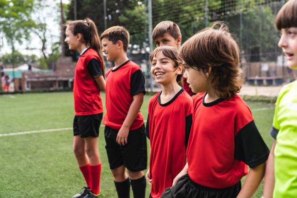 istock Soccer kids players in a row before a competition 1191922315