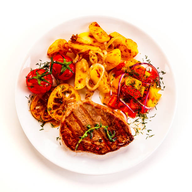 Fried pork and vegetables on white background