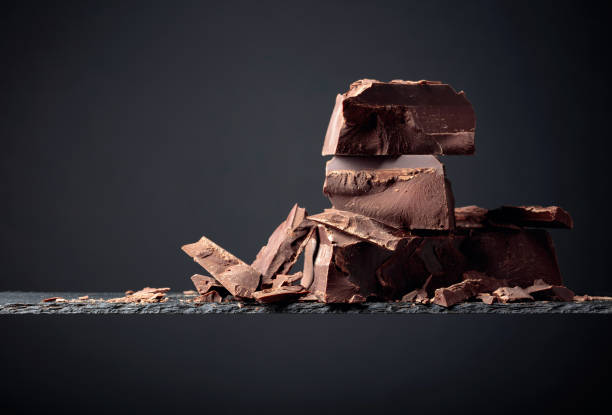 istock Black chocolate on a dark background. 1191923322