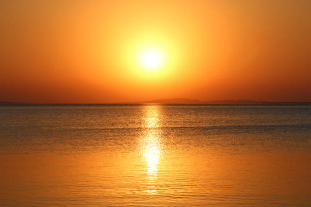 istock dawn above sea. Beautiful summer daybreak above ocean 1191924883