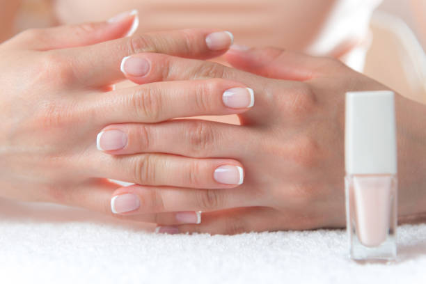 istock Womans hands with beautiful french manicure 1191926913