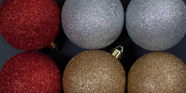 istock elegant red christmas balls lie on a black surface 1191926955