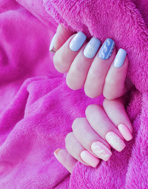 istock female hand beautiful manicure sweater 1191928598