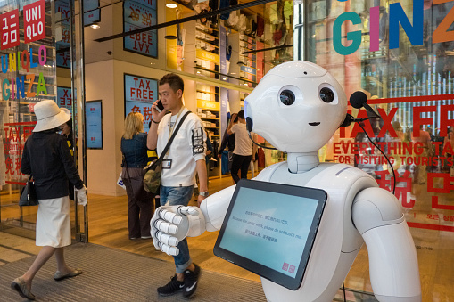 A robot greets customers at Uniqlo's flagship store in Ginza, Tokyo, Japan.