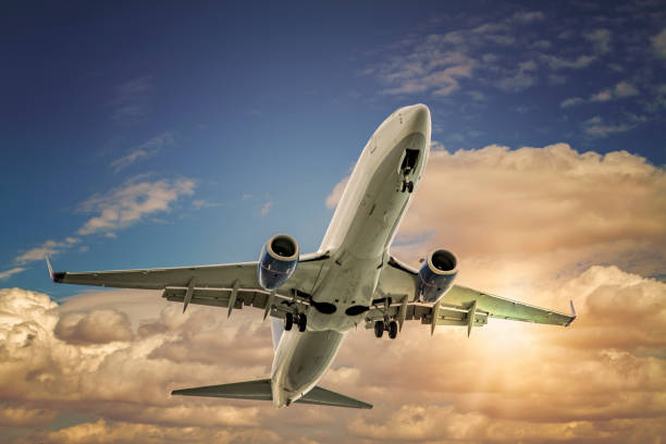 istock Commercial Airliner taking off into the sunset. 1191929717