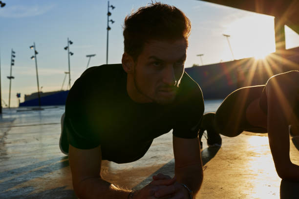 istock Man leans on his elbows and does a push up 1191931097