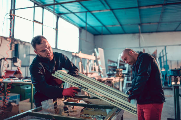 istock Workers Making Window Frame Out Of Aluminum 1191931389