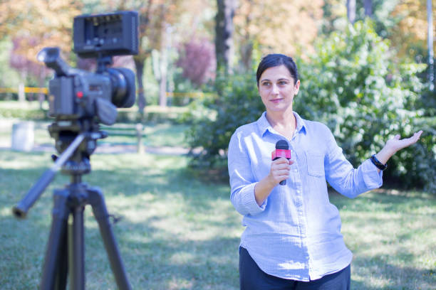 istock Woman reporter reporting from field 1191932459