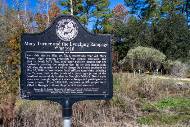 A bullet-riddled sign marks the spot near Hahira, Georgia, where Mary Turner was lynched in 1918. stock photo
