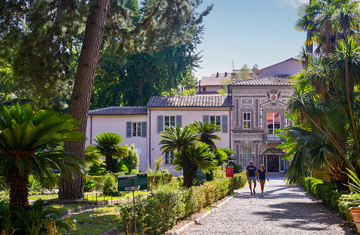 Pisa, Tuscany / Italy - August 16 2019: Exterior of the Orto Botanico of Pisa, a botanical garden operated by the University of Pisa and the first university botanical garden in Europe