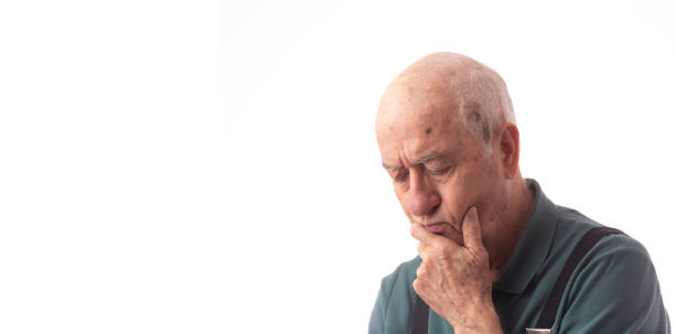 istock Senior man on white wearing green polo suffer from headache 1191935827