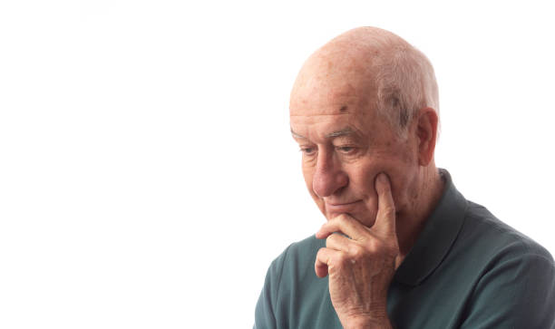 istock Senior man on white wearing green polo looking happy and content 1191935906