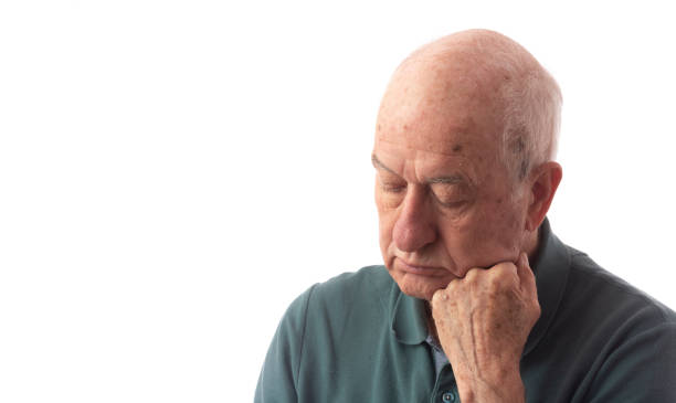 istock Senior man on white wearing green polo suffer from headache 1191935957