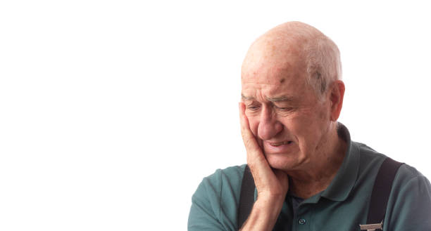 istock Senior man on white wearing green polo looking inquisitive 1191936701