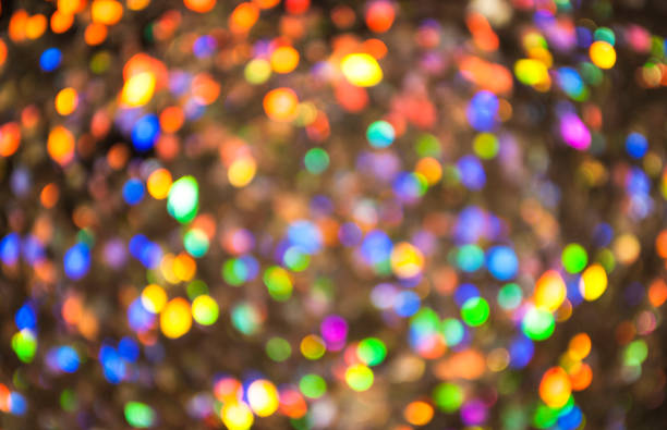 istock Christmas background. Festive glowing color overflows. Defocused chaotic circles Blurred bokeh 1191937098