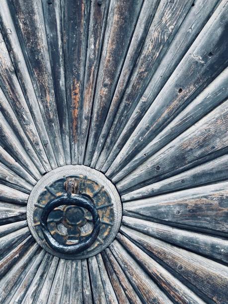 istock Abstract wooden door with round iron handle 1191947100
