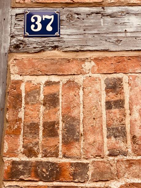 istock Abstract brick wall, house number 37 1191947707