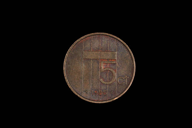 An old Dutch coin isolated on a black background