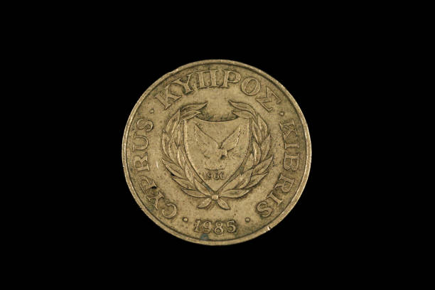 istock An old coin from Cyprus shot on a black background 1191947776