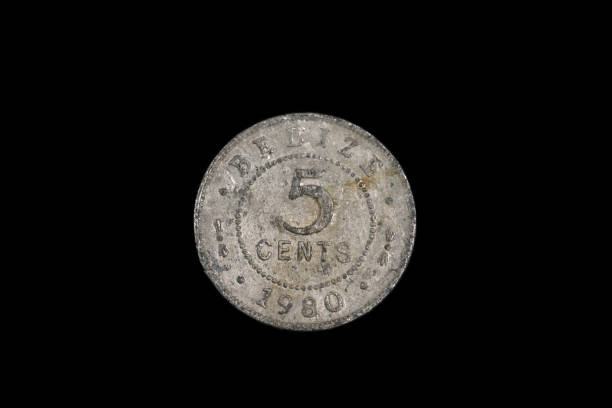 istock An old coin from Belize isolated on a black background 1191947972