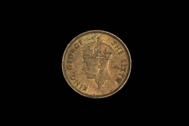 istock An old ten cent coin from British Hong Kong on a black background 1191947995