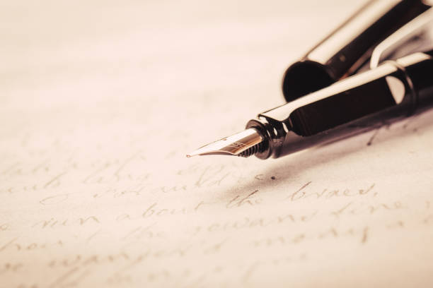 istock fountain pen on paper with ink text closeup 1191951887