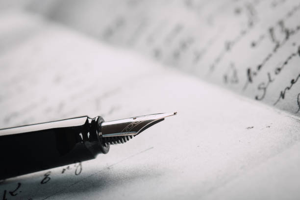 istock fountain pen on paper with ink text closeup 1191951971
