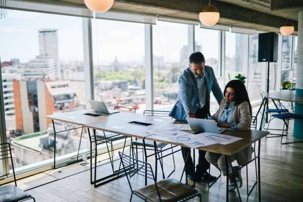 istock Colleagues working together in the Buenos Aires office 1191959404