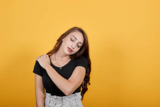 istock Working woman pressing her shoulder as she feels pleasure while was so tired. 1191959415
