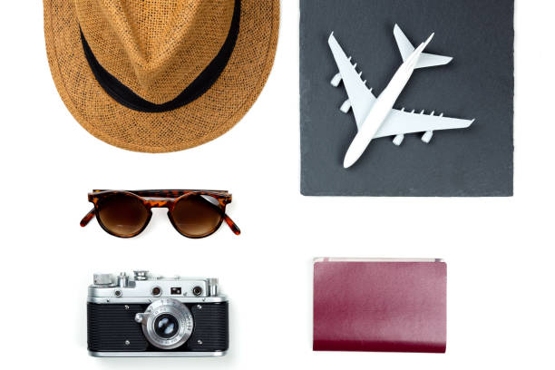 istock Light travel item accessory, hat, airplane, sunglasses, camera and passport,essentials for vacation trip. travel concept background 1191963400