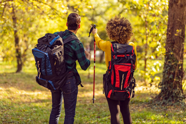 istock Happy couple is hiking in forest. 1191965081
