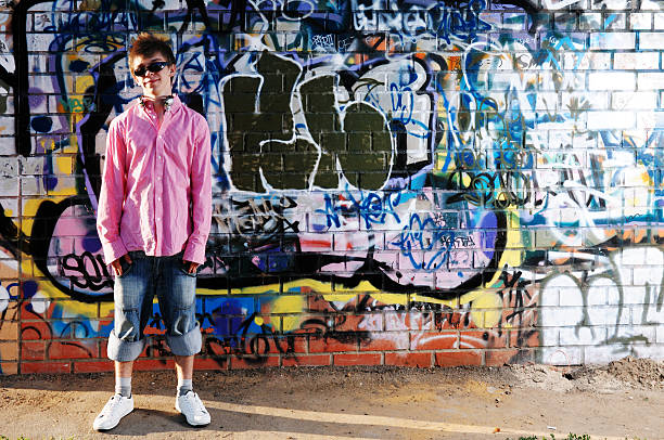 istock Young Teenager against graffiti wall. 119196533