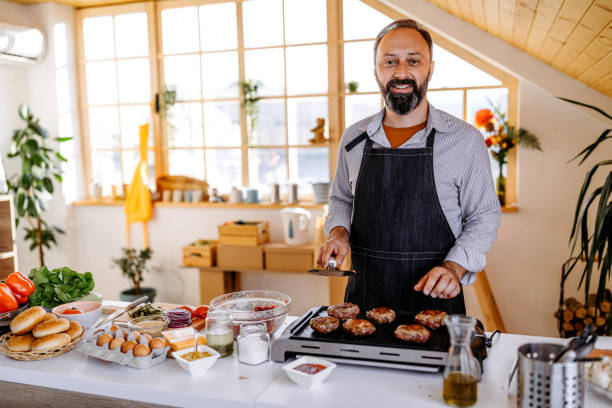 istock Enjoying cooking for his family 1191966068