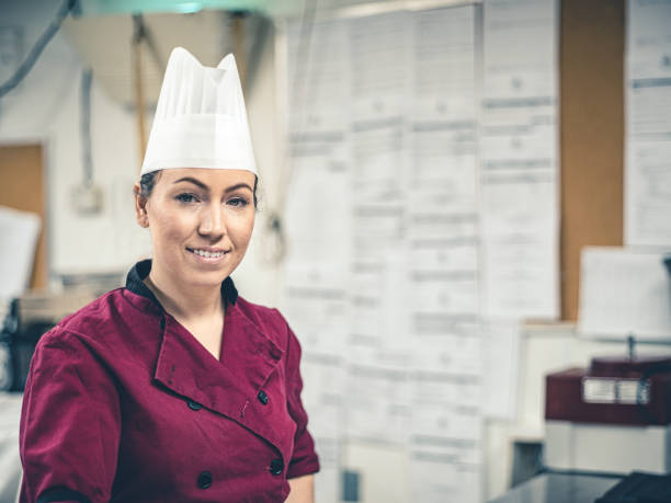 istock Female Chef working in industrial kitchen 1191967112