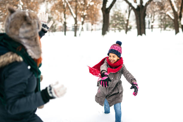 istock Snowball fight in backyard 1191970603