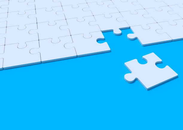 istock White jigsaw puzzle on blue background with copy space 1191971210